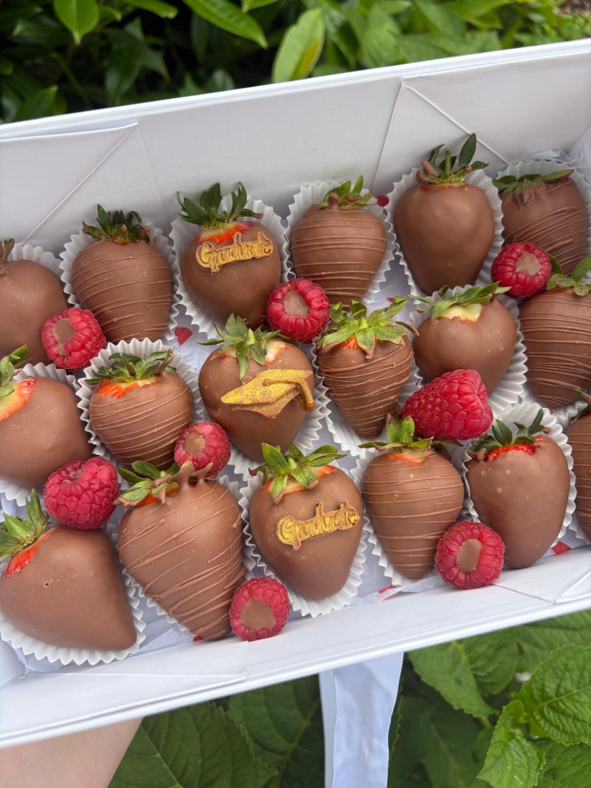 Chocolate strawberry box with gold graduation caps and Graduate decorations